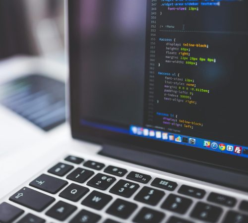 Laptop screen displaying code, perfect for tech-focused projects.